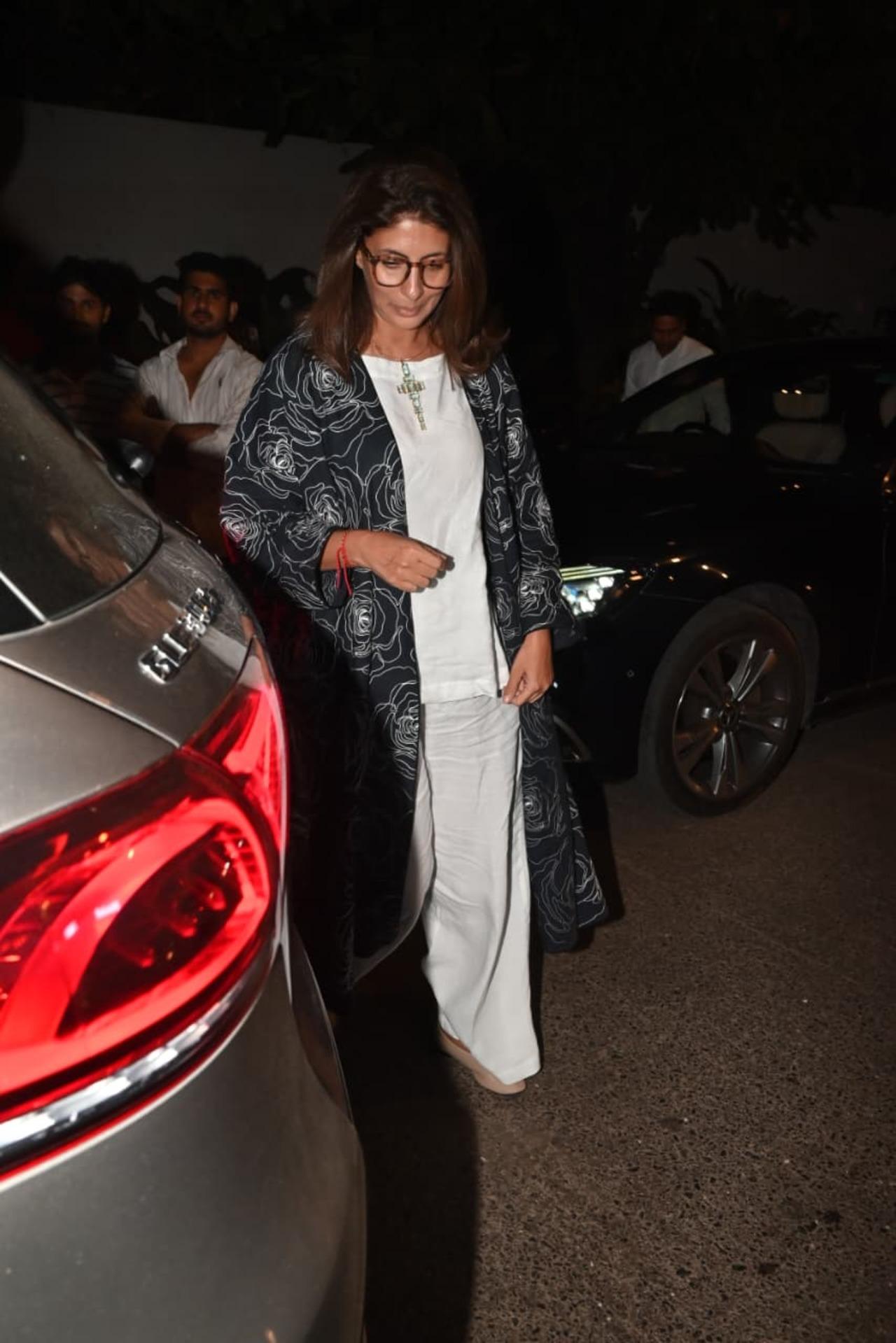 Shweta Bachchan made a striking style statement in an all-white ensemble layered with a long black printed jacket.